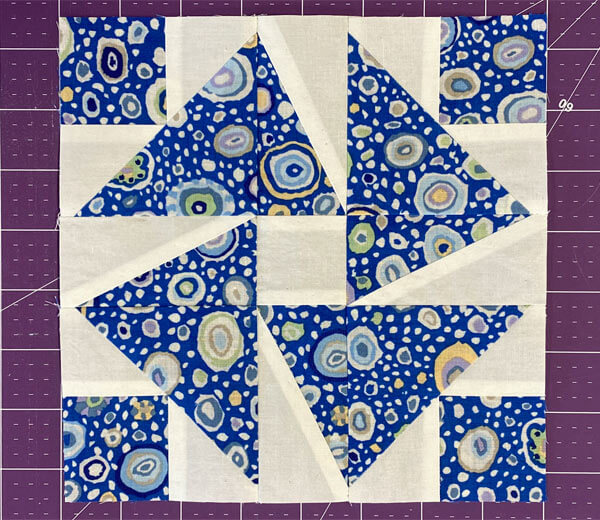 The Leader Quilt Block shown in high contrast blue and white The Leader Quilt Block shown in high contrast blue and white